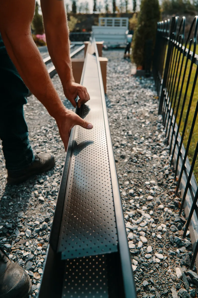 Seamless gutter installation from the ladder — First Choice Gutters LLC, south-central Kentucky BC